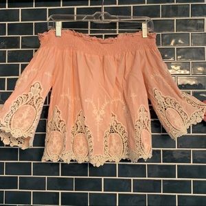 Light pink off the shoulder cut out shirt